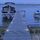 lights on a dock with a boat lift