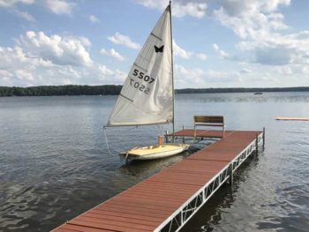 sail boat next to jack down on lake